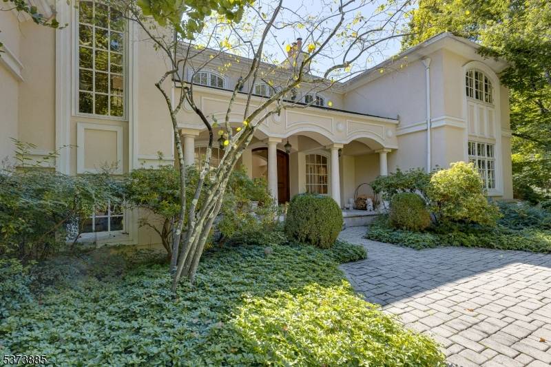 UNBELIEVABLE CUSTOM DESIGNED MEDITERRANEAN ESTATE ON OVER 2 SECLUDED ACRES.