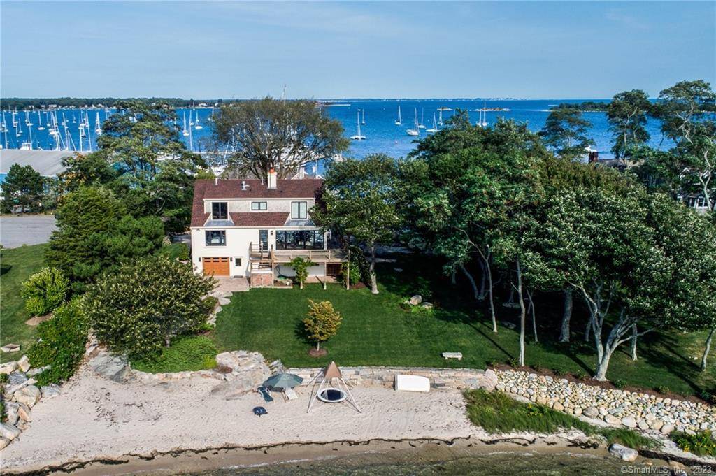 This gorgeous 4 bedroom 3 bath home sits on the CT water front with a beautifully landscaped park like property and two white sandy private beaches.